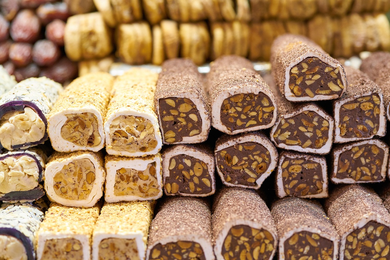 Stacked rolls of Turkish delight filled with crunchy walnuts and coated in fine cocoa powder.