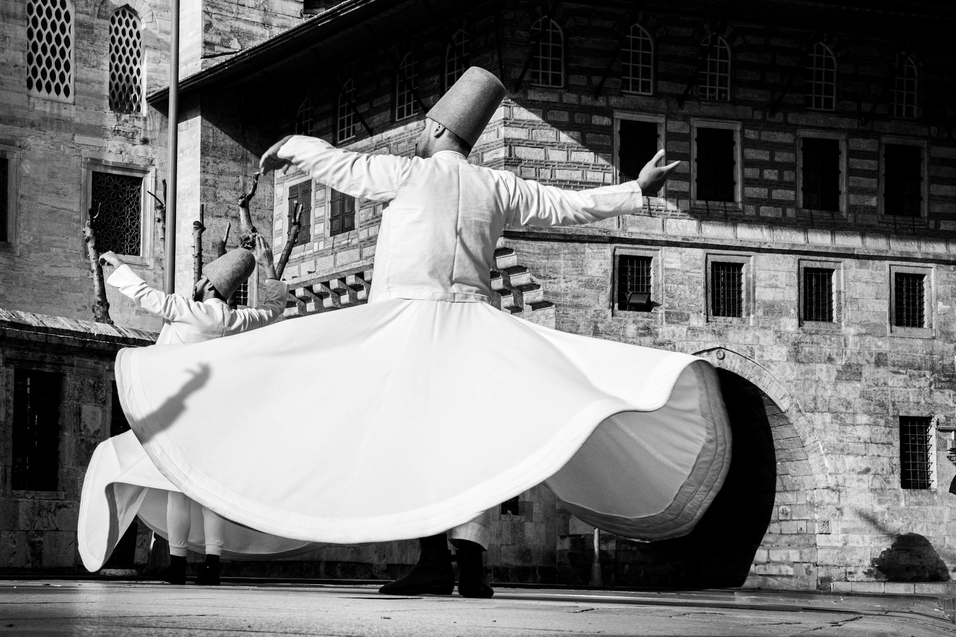 Dervishes perform their spiritual dance outside the stone walls of Yenikapi Mevlevihanesi.